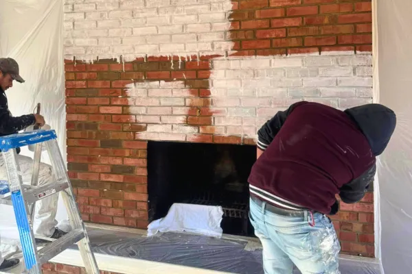 365 Renovations Painters Applying Classico Limewash to Fireplace in West Chester Home